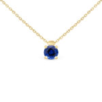 Collier en or jaune avec un pendentif en diamant bleu, mettant en avant une gemme ronde étincelante, idéal pour un style élégant et moderne.